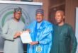 Patching Cancer Out: The president of NSC, Shehu Dikko, supports the Legends World Soccer Charity