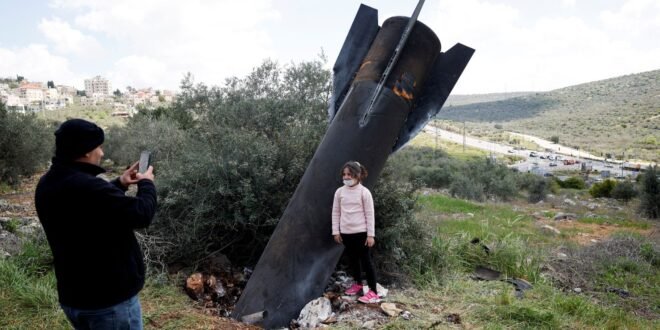 Children play with missile like remnants of projectiles depicted throughout the Middle East | World News