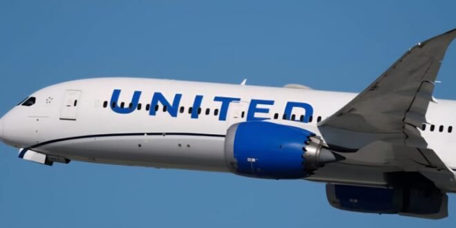 A passenger on a United flight from Newark attempted to open the door at…