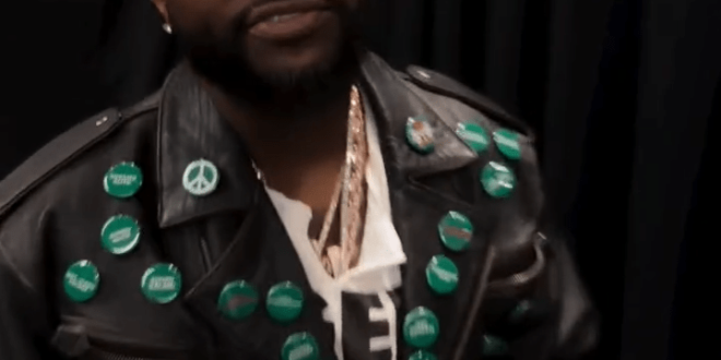 Davido wore a jacket bearing the name of the kidnapped Oyo student while watching the World Cup countdown show