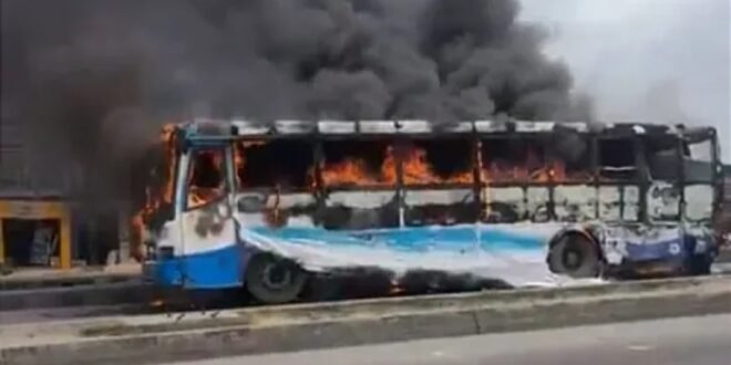 An angry mob sets fire to a BRT bus after the death of a motorcyclist in Lagos